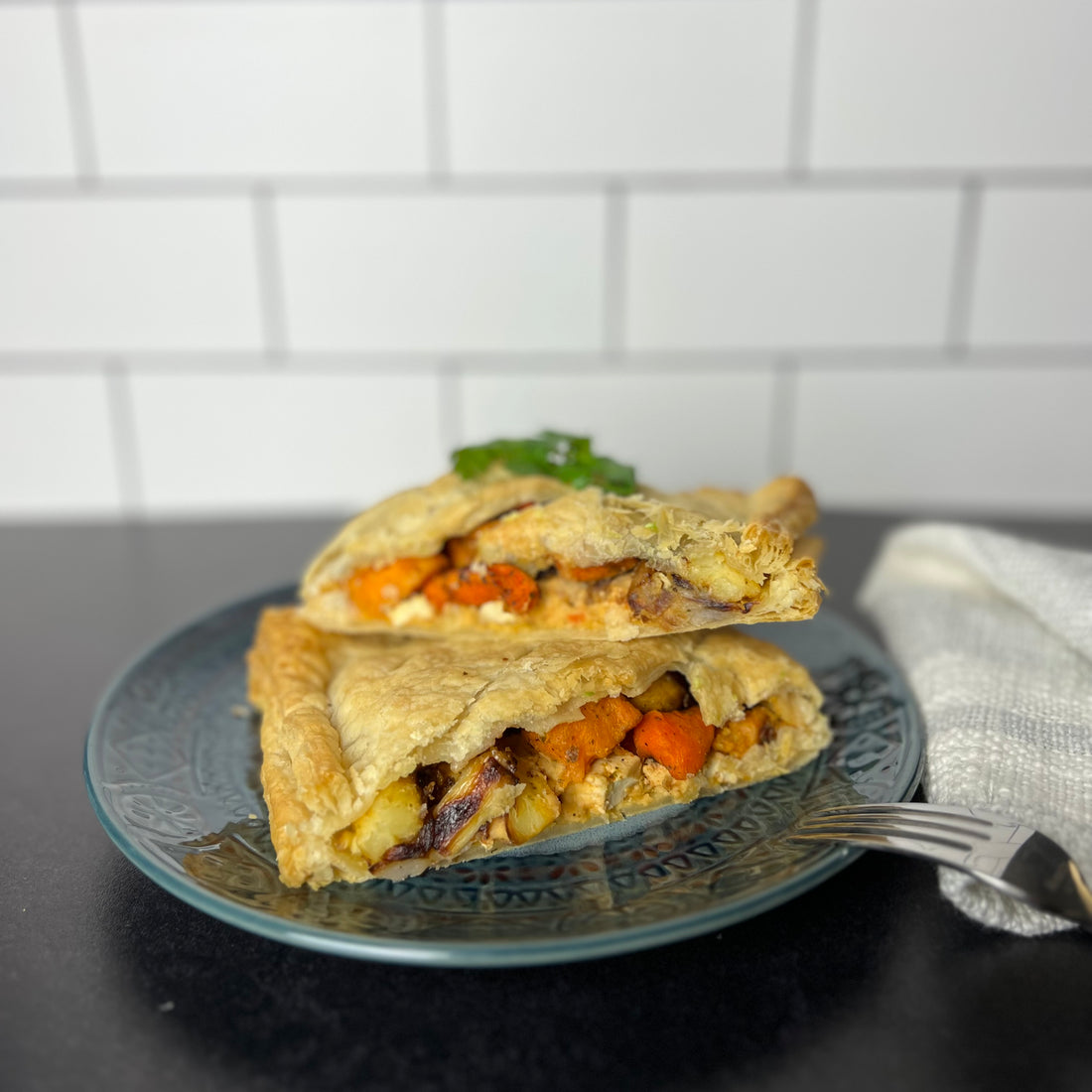 Roasted Vegetable Wellington;      This delicious, plant-based Roasted Vegetable Wellington is loaded with nourishing roasted veggies, herbs and tofu, all encased in a golden flaky pastry. It's easy to make and an ideal festive dish for those looking to enjoy something unique and nutritious.