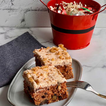 Carrot Cake;4 individual bars perfect for any time indulgence. Moist, sweet, delisious cake loaded with carrots, raisins and walnuts topped with creamy tofu cream cheese. Allergens: wheat, soy, walnuts Per serving( 1 bar): cal 260, fat 10g carbs:40g, fiber 2g, protein 3g