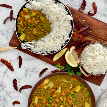 Burmese Lentil Potato Curry: Colorful warmly spiced aromatic bowl of goodness with. Carrots, potatoes, lentils, and peas simmered in luxuriously rich coconut milk curry sauce served over bowl of hot basmati rice.