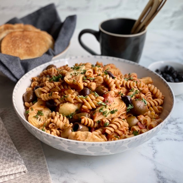 One Pot Greek Pasta: Rich, flavorful, punch of protein one pot wonder. Tender pasta, garlic, olives, artichokes, tomatoes, chickpeas and capers cooked in veggie broth with Mediterranean spices makes easy delicious fun dinner.